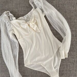 Elegant Cream Bodysuit with Sheer Sleeves